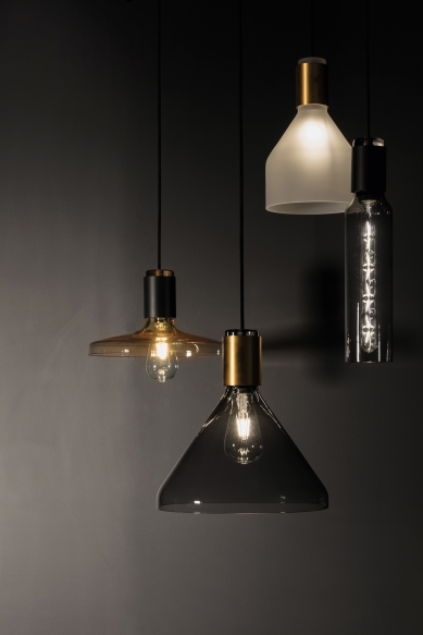 Delta Light introduced three collections of decorative lighting with delicate lines and glass