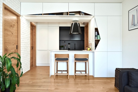 <blockquote>Modest sized apartment for maximum use</blockquote> - Attic apartment Nusle - central living area of the kitchen - foto: Daniel Čáha pro M&T