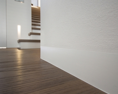 Hidden plinth strip DORSIS – a small technical detail with a big visual effect - With the installation of the Linus skirting board, it is necessary to account for it before the finishing work.